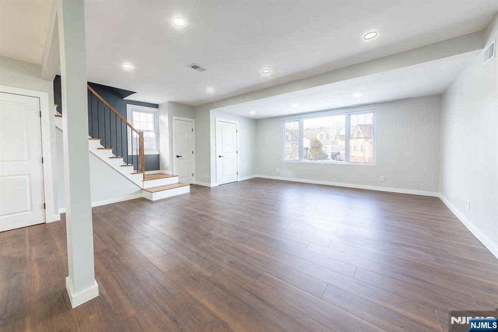 34 Kearny Street Lyndhurst, NJ 07071 - Photo 4 of 29 a view of an empty room with wooden floor and a window