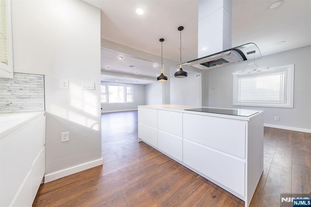 34 Kearny Street Lyndhurst, NJ 07071 - Photo 7 of 29 a view of a kitchen center island wooden floor and windows
