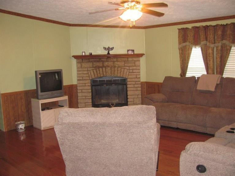 737 Azbill Road McKee, KY 40447 - Photo 11 of 29 Family room with cozy wood burning firep