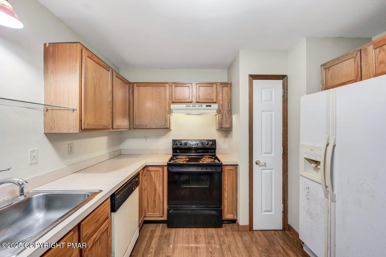 613 Country Acres Court Effort, PA 18330 - Photo 16 of 40 a kitchen with a refrigerator stove and sink