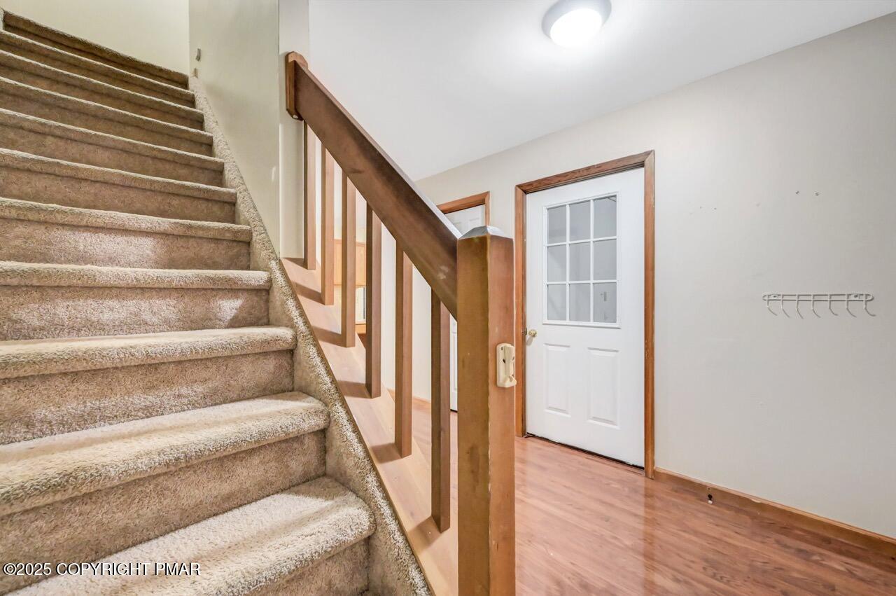 613 Country Acres Court Effort, PA 18330 - Photo 20 of 40 a view of staircase with wooden floor and white walls