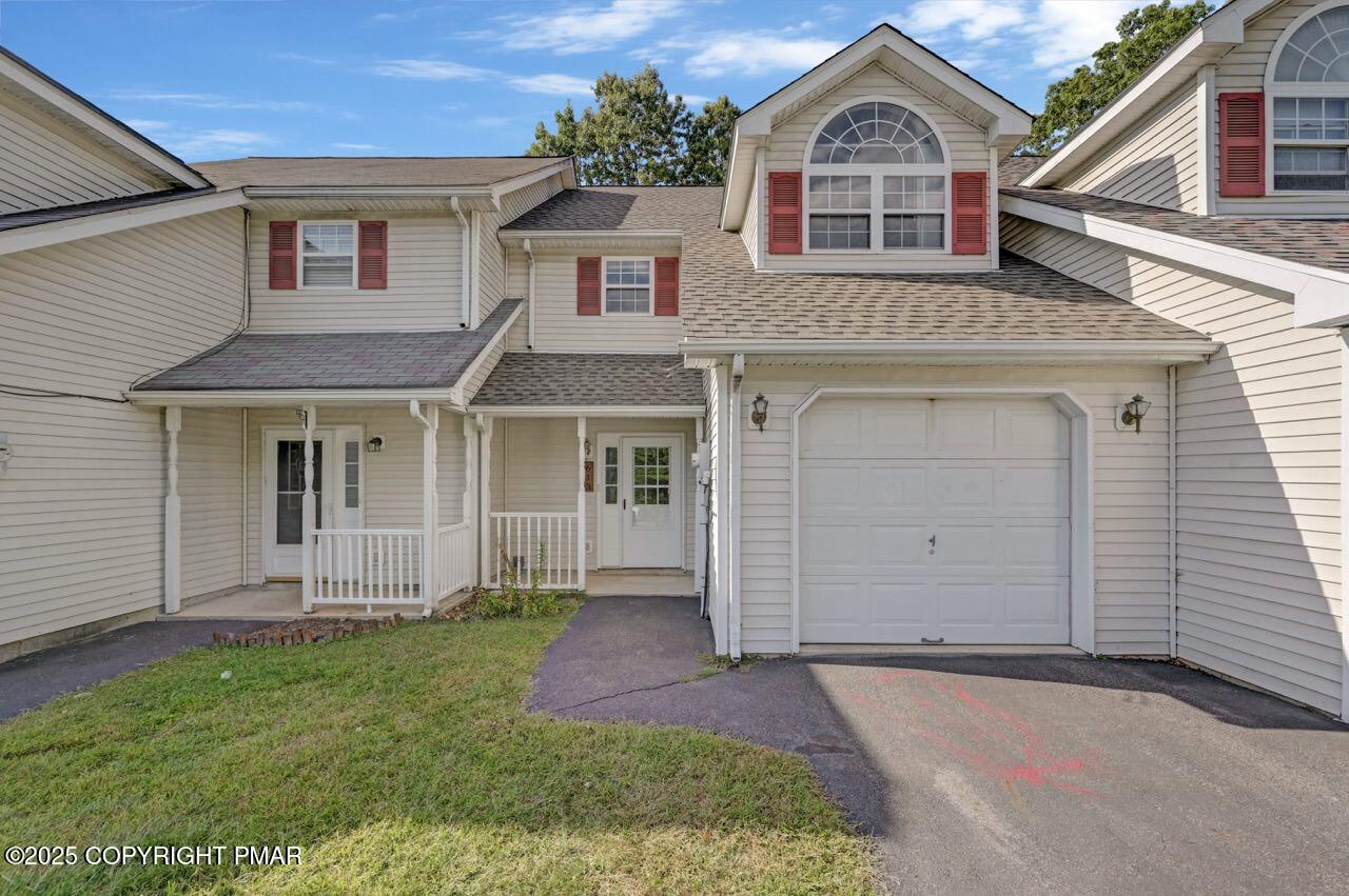 613 Country Acres Court Effort, PA 18330 - Photo 2 of 40 a front view of a house with a garden