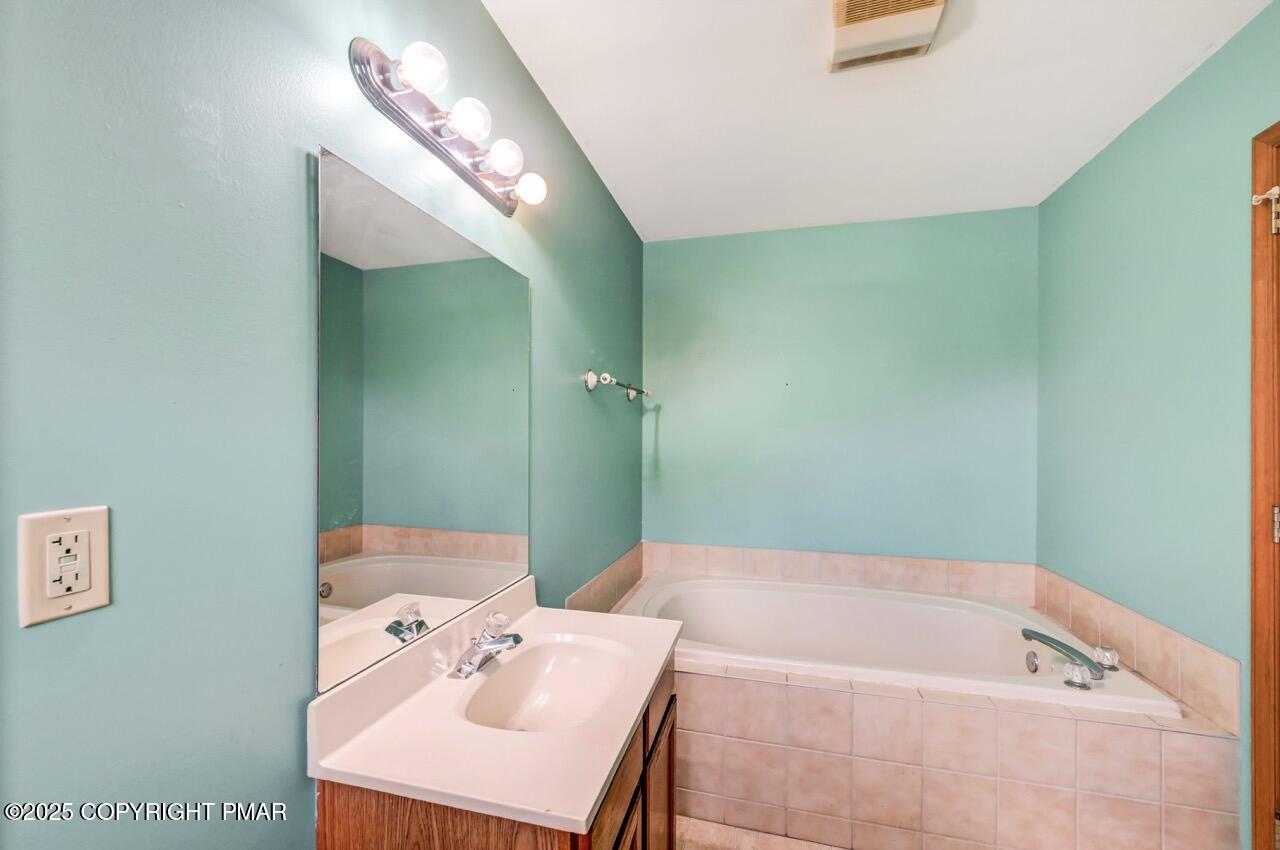 613 Country Acres Court Effort, PA 18330 - Photo 27 of 40 a bathroom with a bathtub and a sink
