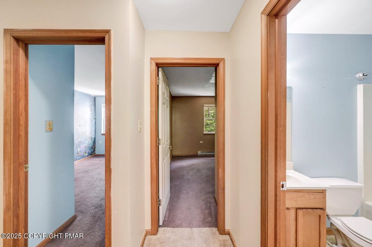 613 Country Acres Court Effort, PA 18330 - Photo 30 of 40 a view of a hallway with wooden floor and closet