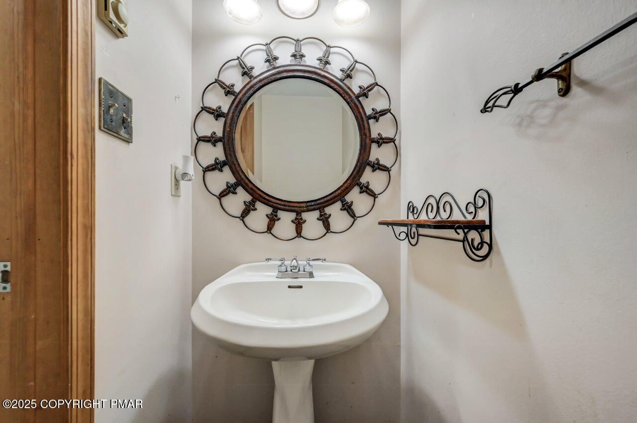 613 Country Acres Court Effort, PA 18330 - Photo 6 of 40 a bathroom with a sink and a mirror