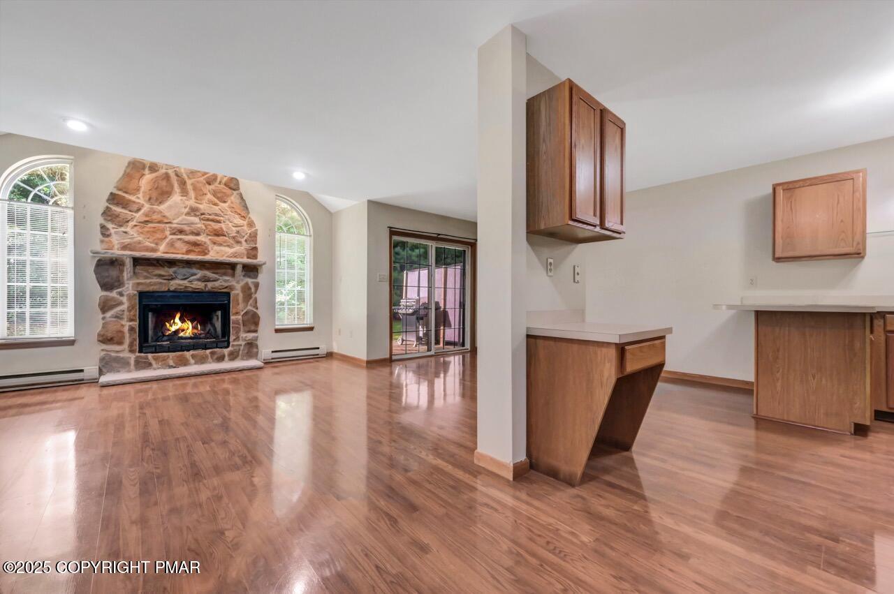 613 Country Acres Court Effort, PA 18330 - Photo 7 of 40 a living room with wooden floor and a fireplace
