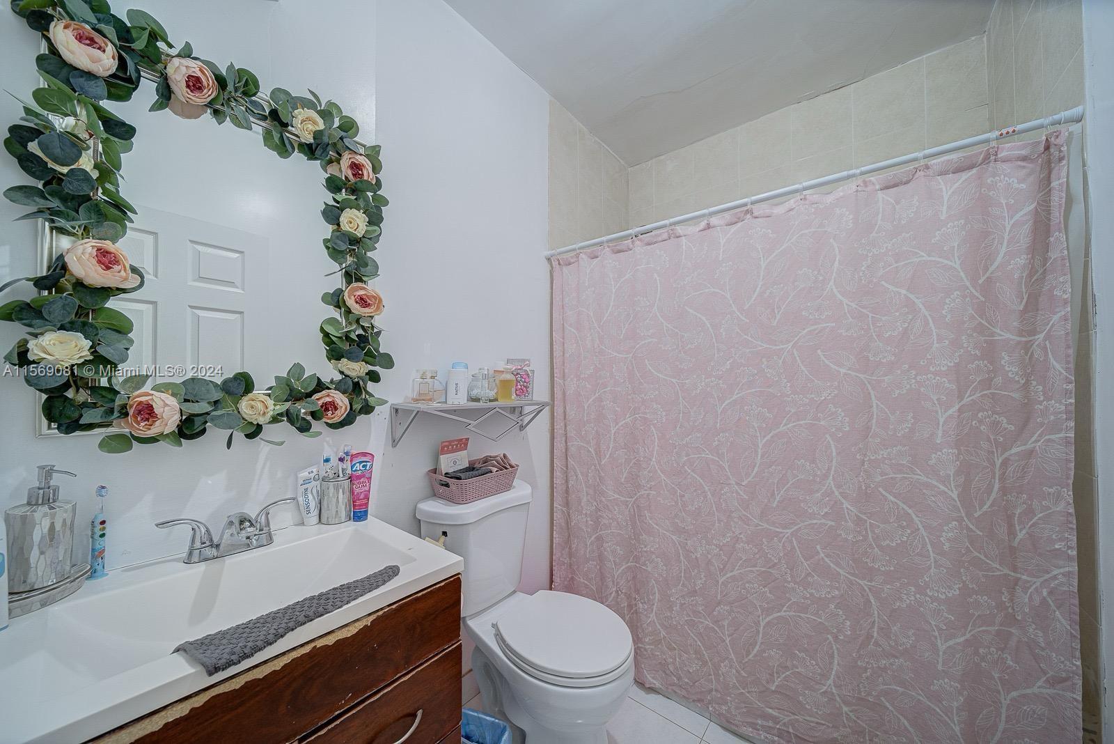 627 Southwest 11th Avenue Miami, FL 33130 - Photo 12 of 15 a bathroom with a sink toilet and a mirror