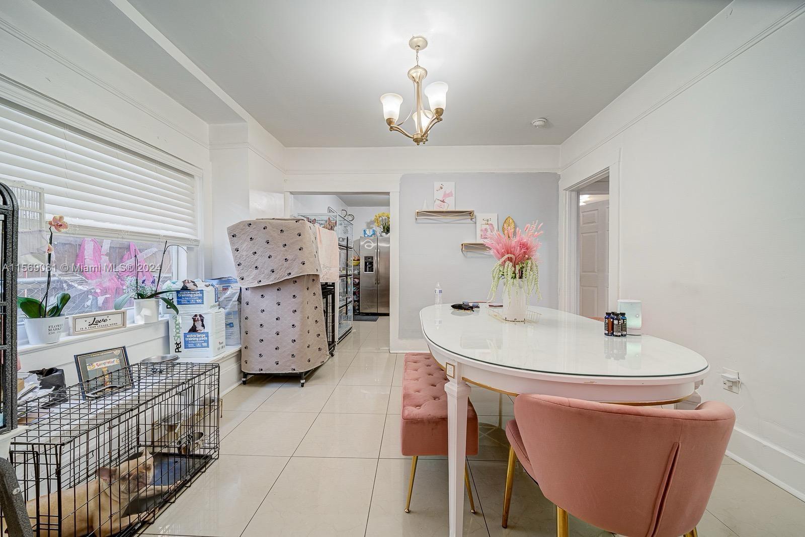 627 Southwest 11th Avenue Miami, FL 33130 - Photo 13 of 15 a dining room with furniture and chandelier
