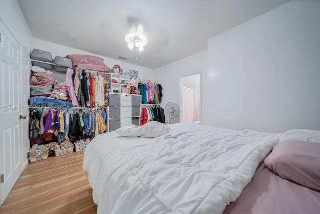 a bed room with a bed and a walk in closet