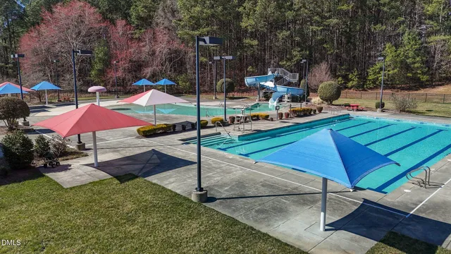 a view of a backyard with sitting area