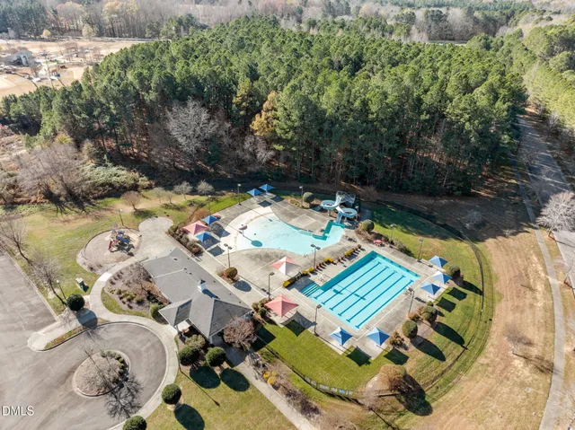 an aerial view of a house with a ocean view