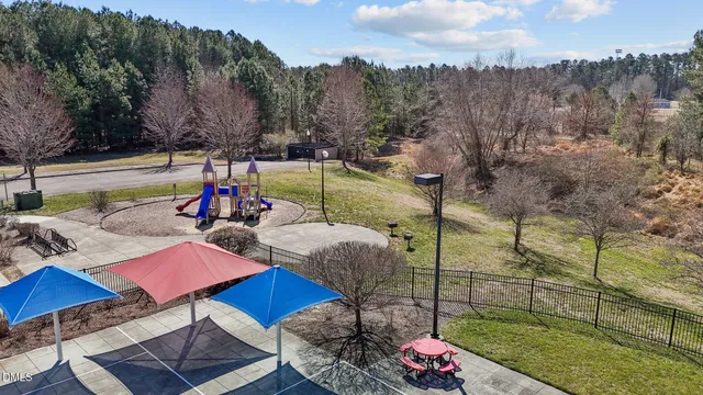 a view of a swimming pool of a house with a yard