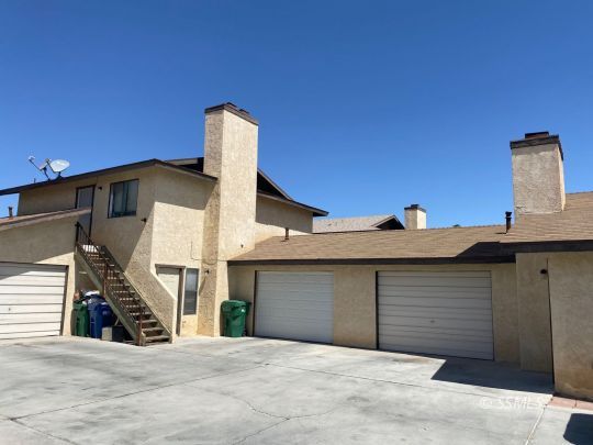 405 South Sunset Street Ridgecrest, CA 93555 - Photo 2 of 17 a view of a house with a garage
