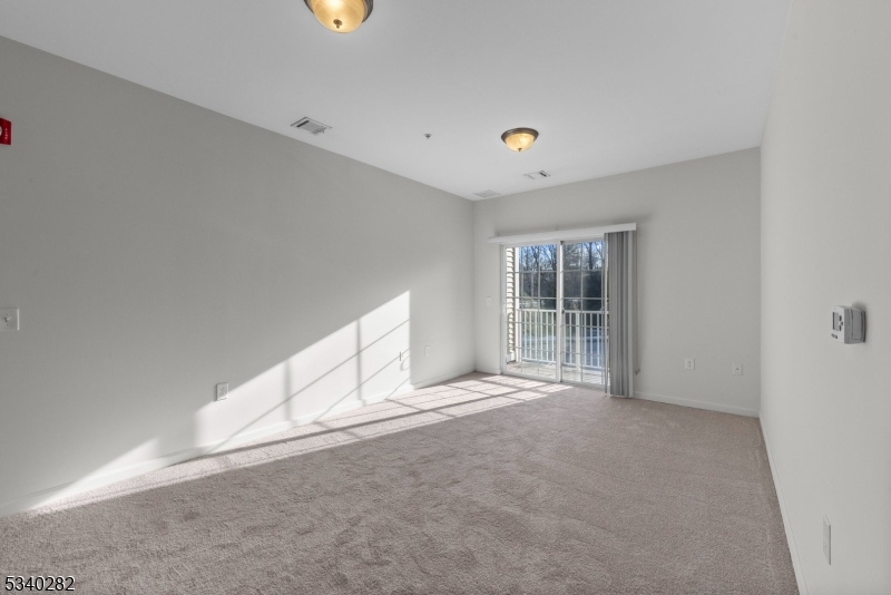 41 Park Drive, Unit 41 Clinton, NJ 08809 - Photo 12 of 38 a view of an empty room with a window