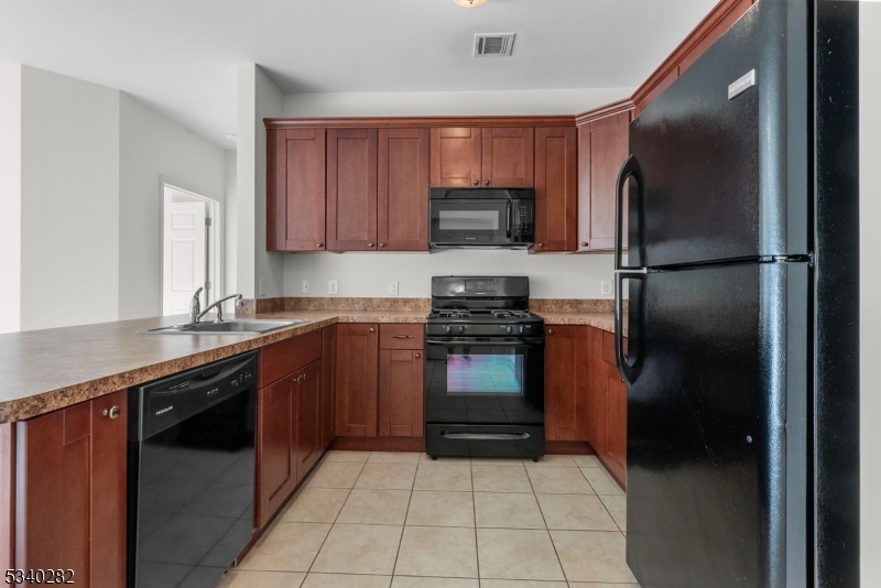 41 Park Drive, Unit 41 Clinton, NJ 08809 - Photo 18 of 38 a kitchen with a refrigerator sink and microwave
