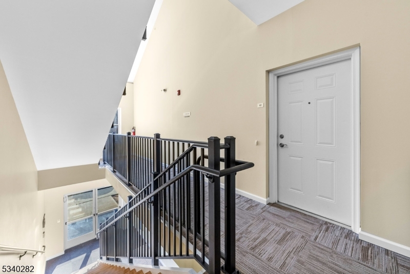 41 Park Drive, Unit 41 Clinton, NJ 08809 - Photo 30 of 38 a view of a hallway with wooden floor and staircase
