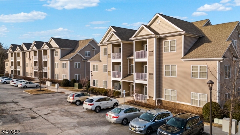 41 Park Drive, Unit 41 Clinton, NJ 08809 - Photo 9 of 38 a car parked in front of a white house