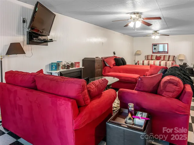 a living room with furniture and a flat screen tv