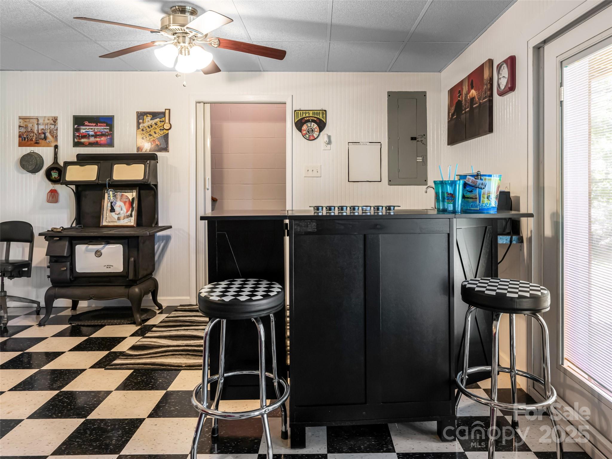 129 Melrose Lake Road Saluda, NC 28773 - Photo 25 of 48 a kitchen with a refrigerator and a stove top oven