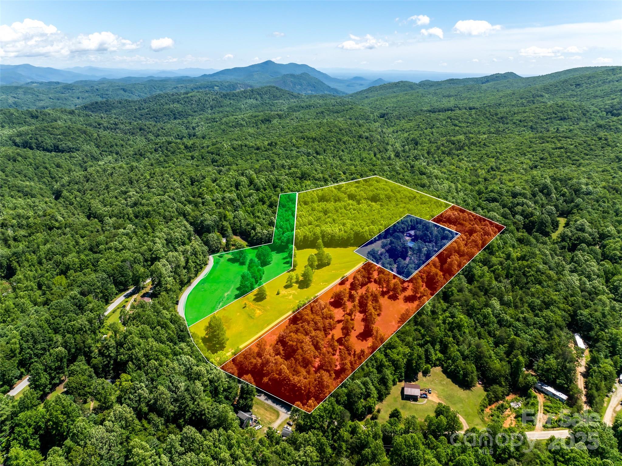 129 Melrose Lake Road Saluda, NC 28773 - Photo 4 of 48 an aerial view of a house