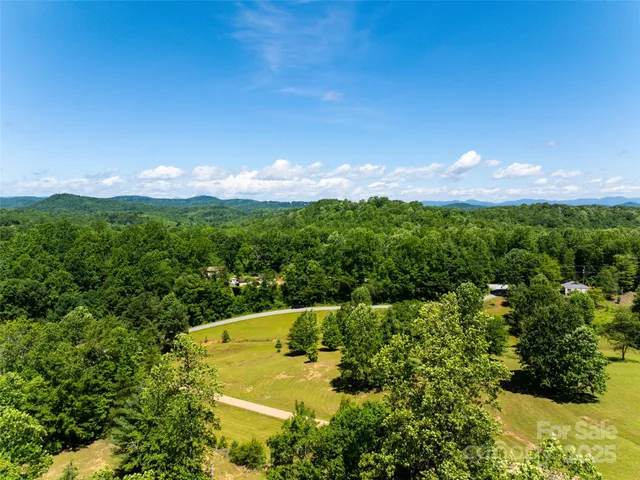 a view of a lake with green space
