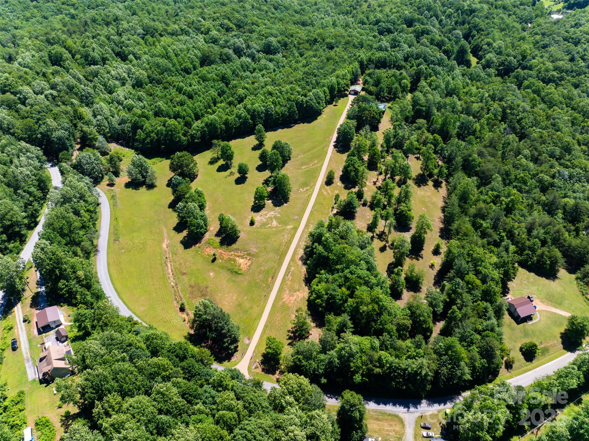 129 Melrose Lake Road Saluda, NC 28773 - Photo 47 of 48 an aerial view of a house with swimming pool