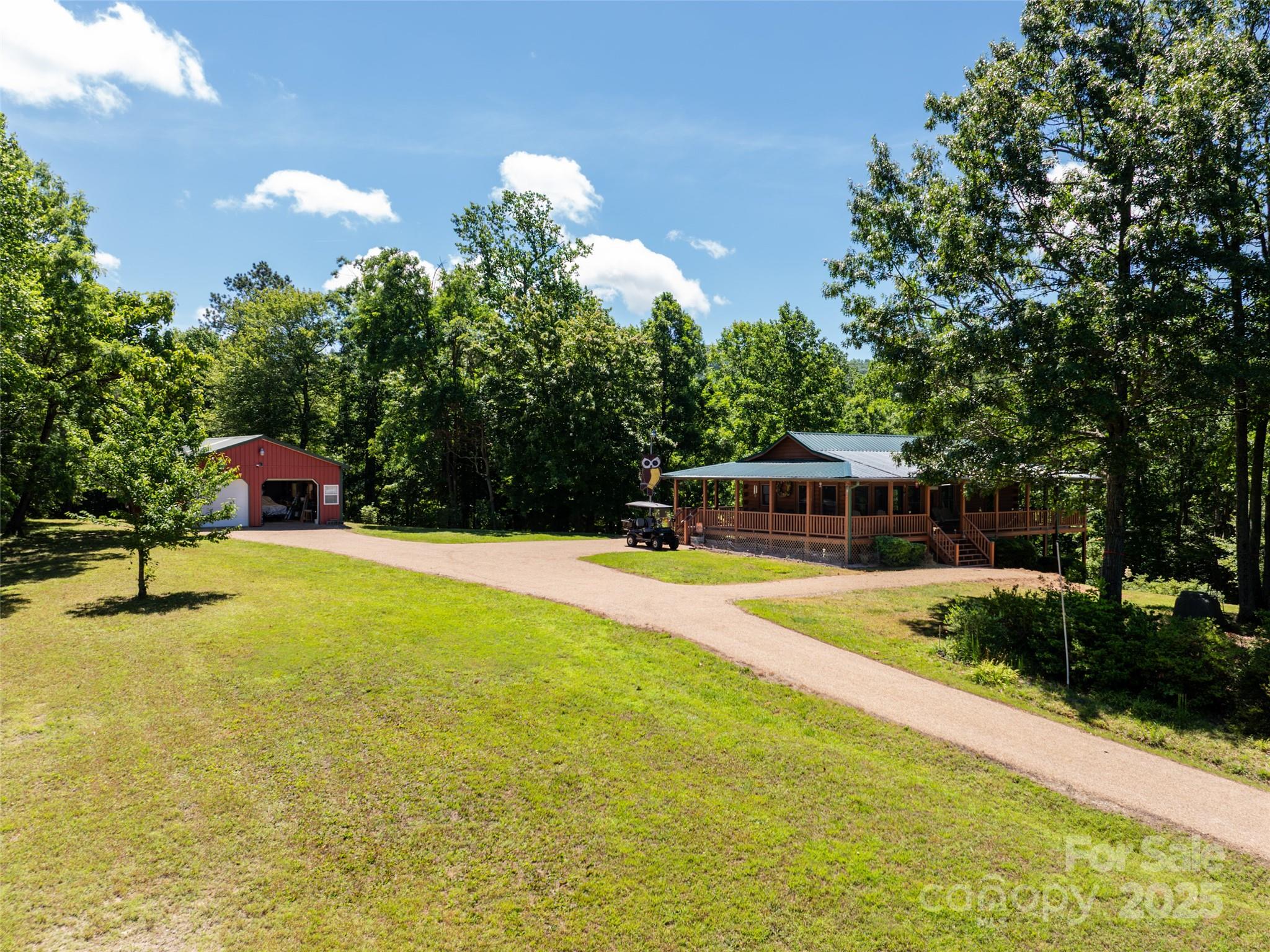 129 Melrose Lake Road Saluda, NC 28773 - Photo 5 of 48 a swimming pool with yard and trees in the background