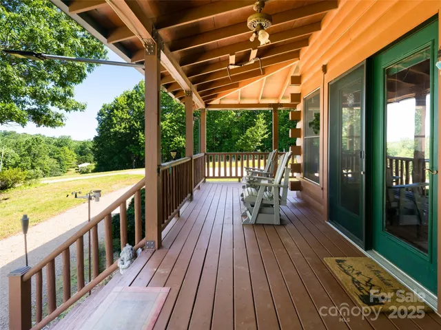 a view of a balcony with wooden floor