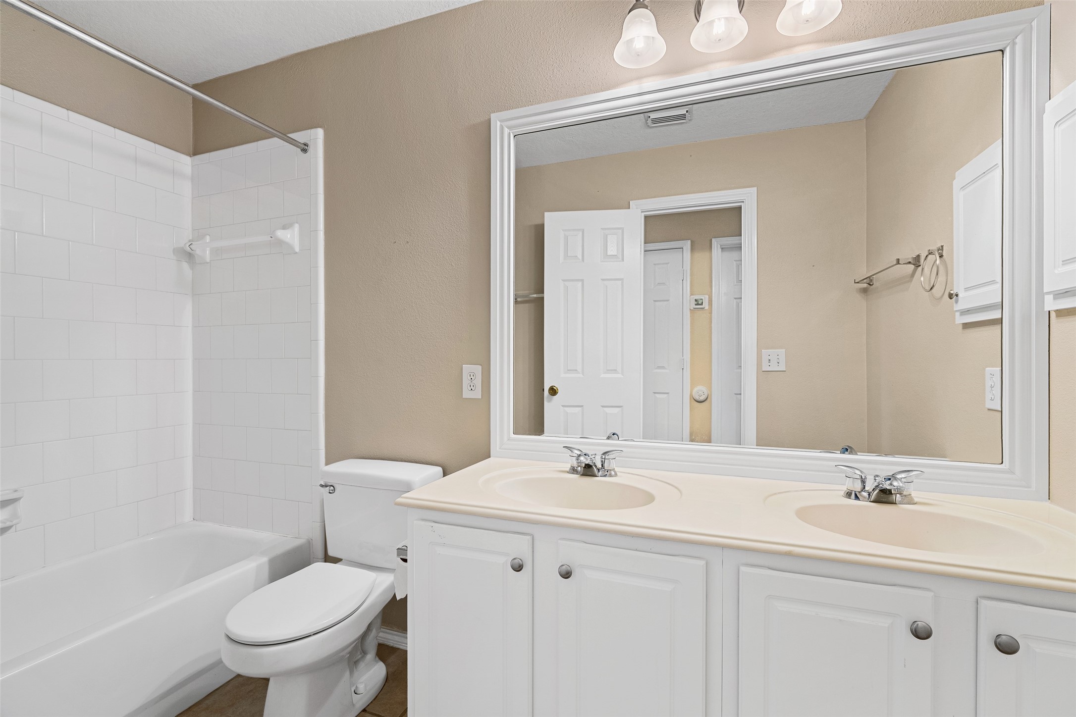2218 Louetta Brook Lane Spring, TX 77388 - Photo 11 of 18 a bathroom with a sink a toilet and a mirror