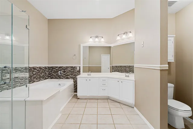 a bathroom with a bathtub sink and toilet
