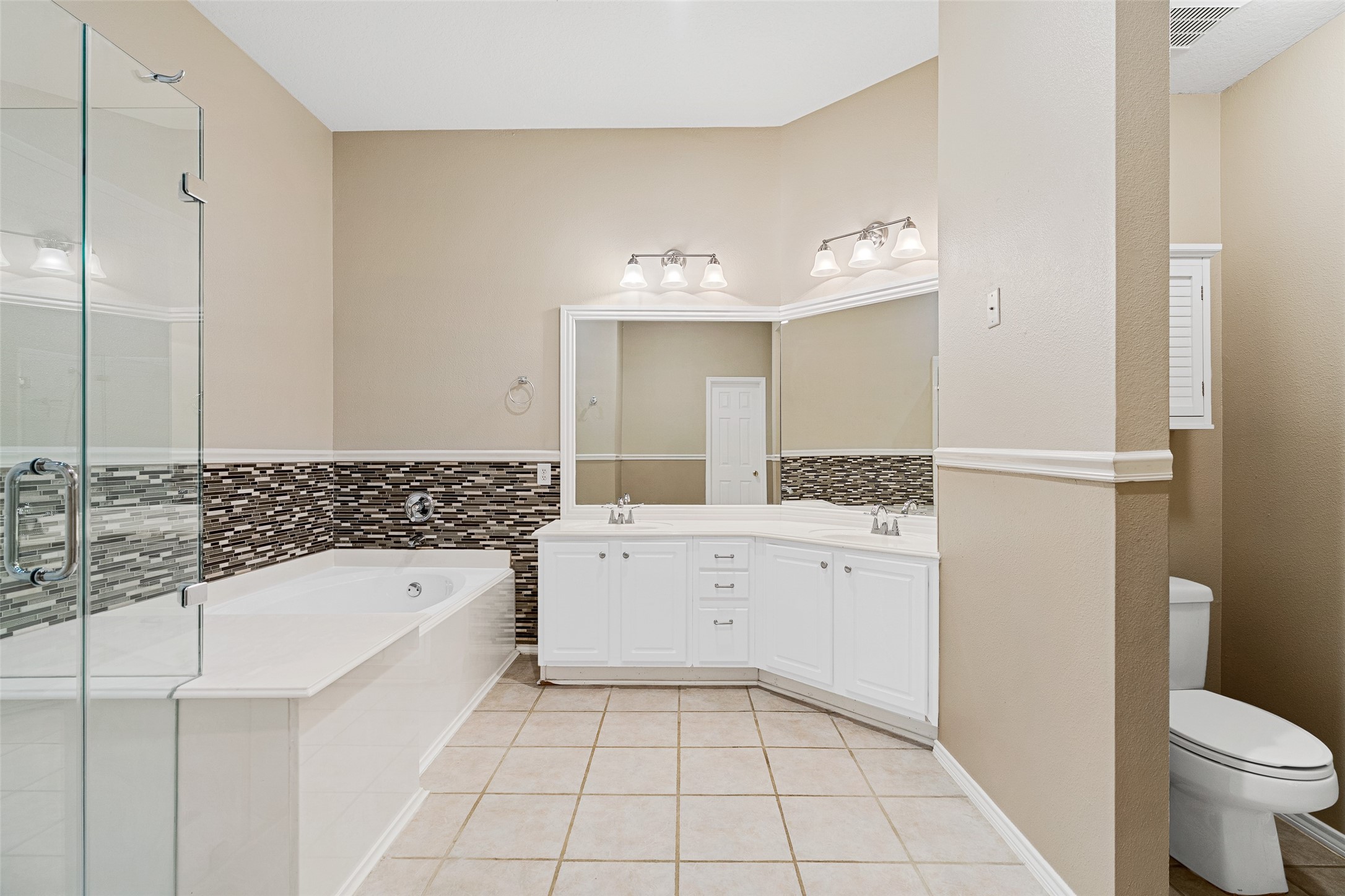2218 Louetta Brook Lane Spring, TX 77388 - Photo 9 of 18 a bathroom with a bathtub sink and toilet