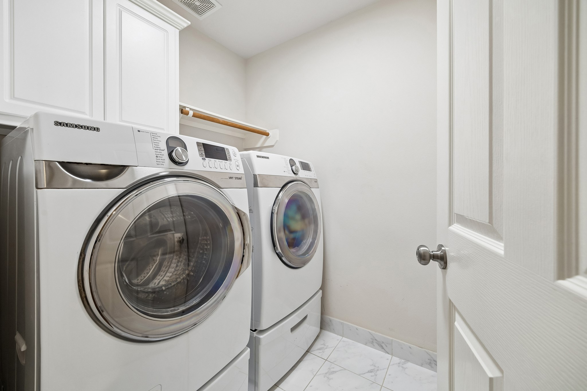 7618 North Linpar Court Houston, TX 77040 - Photo 24 of 34 The second floor laundry room. The impressive washer and dryer stay with the home!