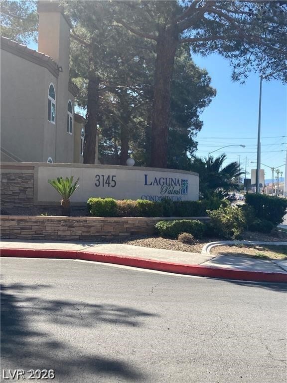 3145 East Flamingo Road, Unit 2100 Las Vegas, NV 89121 - Photo 1 of 34 Mature trees and vibrant landscaping frame the welcoming community entrance.