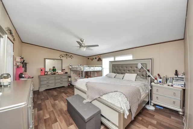 a bedroom with a bed and a dresser