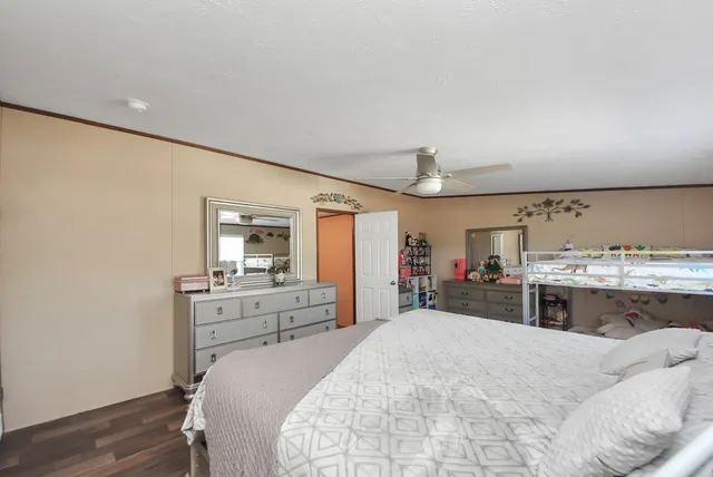 a bed room with a bed and dresser