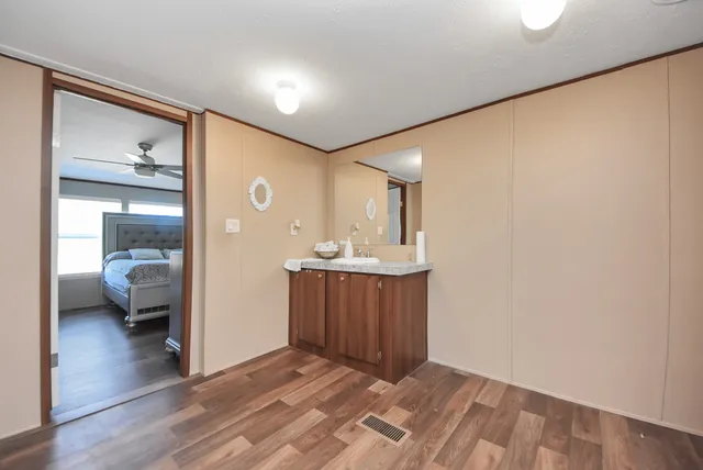 a view of a bathroom from the hallway