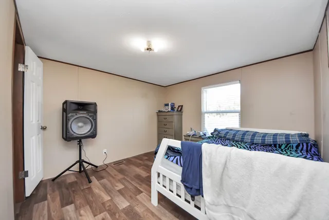 a bed room with a bed and a lamp