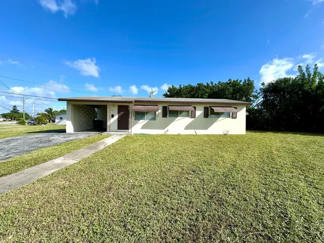 a view of swimming pool with outdoor seating and deck