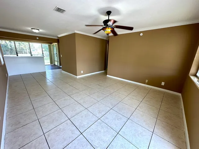 a view of a room with wooden floor and staircase