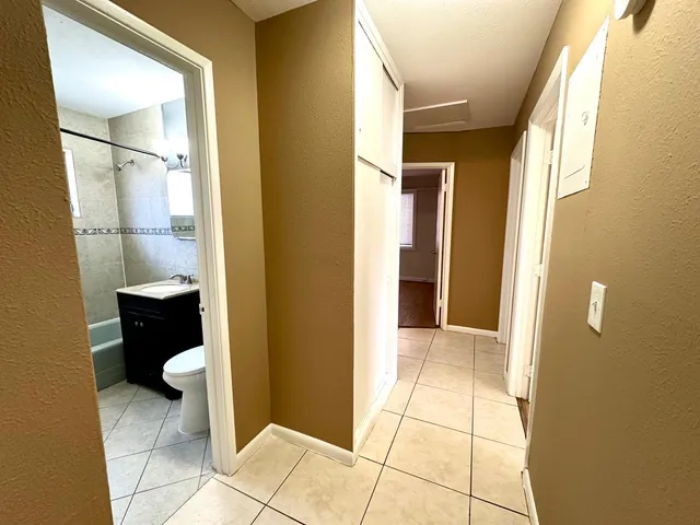 a view of an empty room with a window