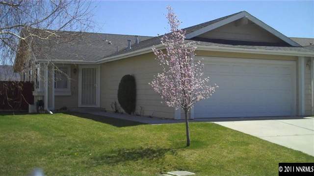 7534 Devonshire Lane Reno, NV 89511 - Photo 1 of 8 a front view of a house with garden