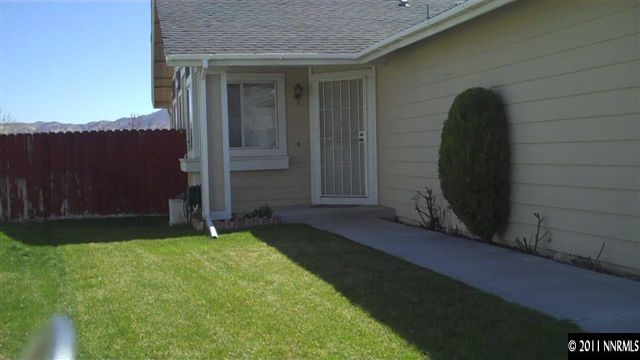 7534 Devonshire Lane Reno, NV 89511 - Photo 3 of 8 a view of a backyard of the house
