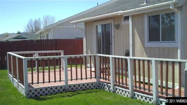 7534 Devonshire Lane Reno, NV 89511 - Photo 7 of 8 a view of a house with backyard and porch