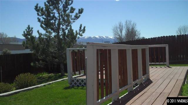 7534 Devonshire Lane Reno, NV 89511 - Photo 8 of 8 a view of backyard with deck and garden