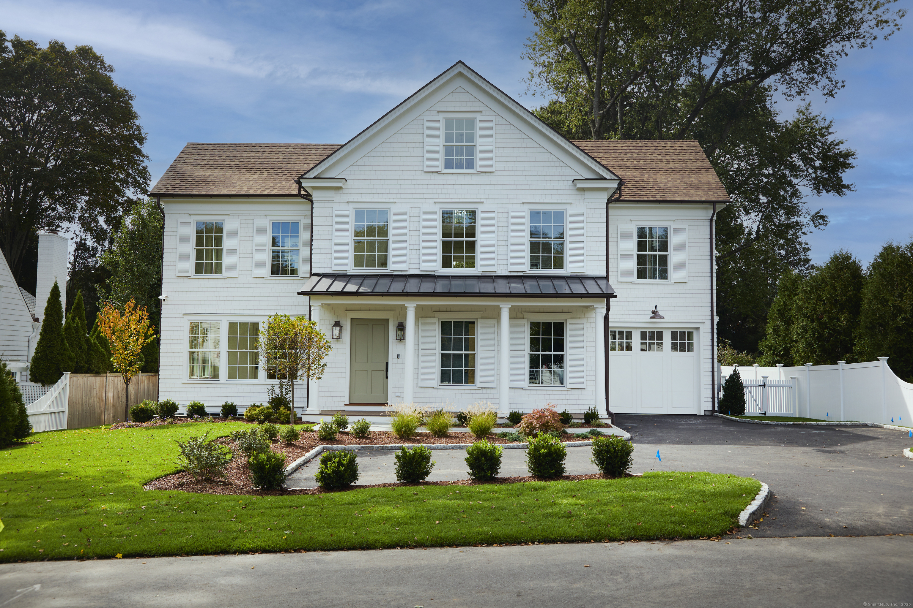 5 Franklin Avenue Westport, CT 06880 - Photo 1 of 16 a front view of house with yard and green space