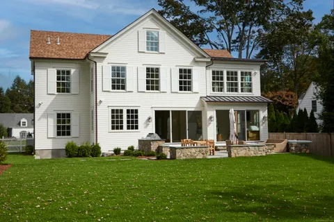 a front view of a house with a yard