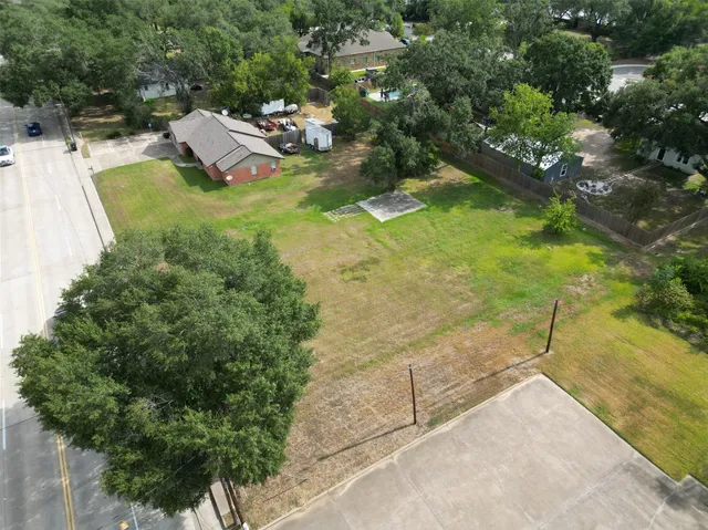 a backyard of a house with yard and outdoor seating