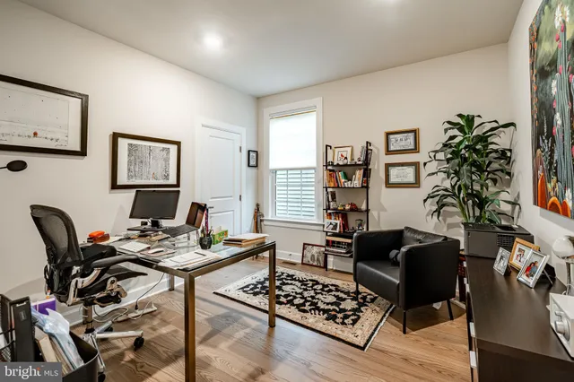 a work room with furniture and wooden floor