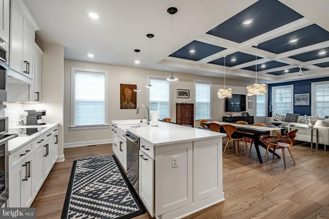 a large white kitchen with lots of counter top space