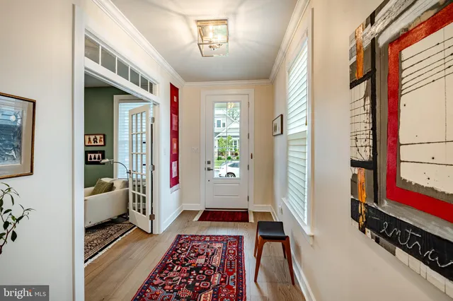 a hallway with furniture and a rug